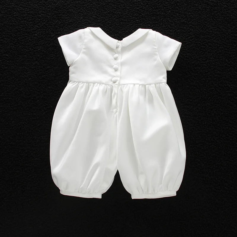 White boys formal romper with turn-down collar and button-back closure. Cotton blend special occasion outfit for infants and toddlers.