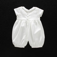 White boys formal romper with turn-down collar and button-back closure. Cotton blend special occasion outfit for infants and toddlers.