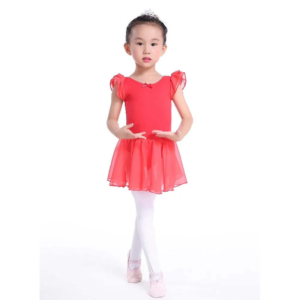 Red girls ballet tutu dress with puff sleeves worn by young child in white tights and pink ballet shoes