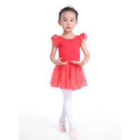 Red girls ballet tutu dress with puff sleeves worn by young child in white tights and pink ballet shoes