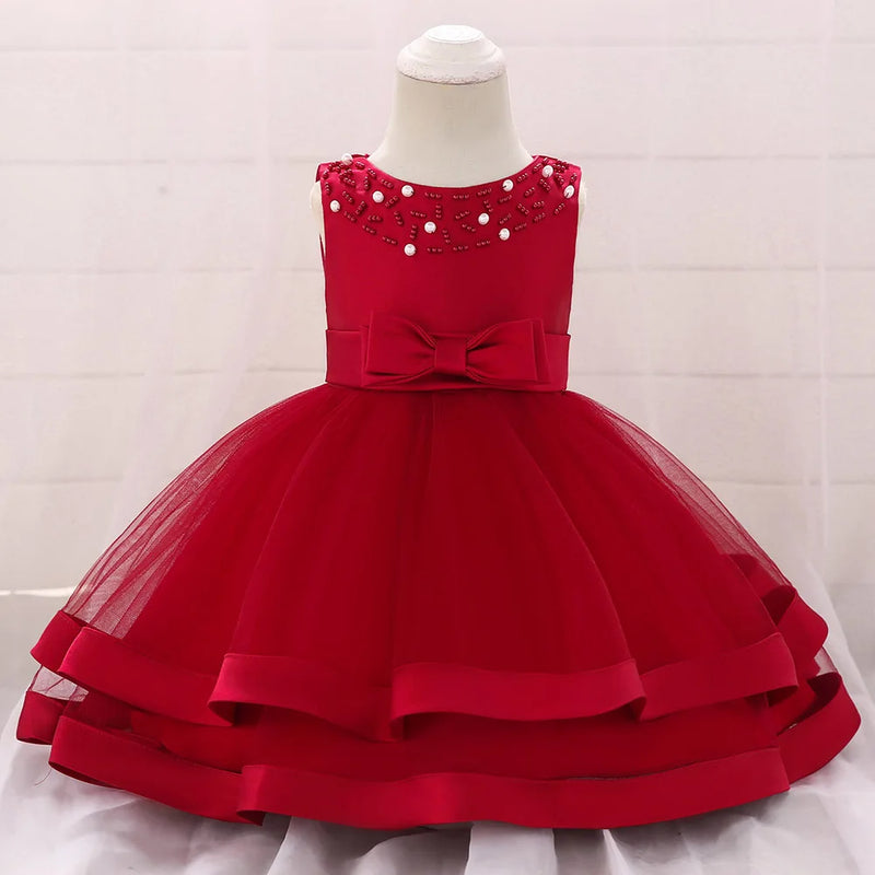 The 'Sacha Marie' Elegant Tiered Special Occasion Dress in vibrant red, featuring a beautiful tiered skirt, a bow detail, and elegant bead embellishments.