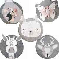 Set of round animal-themed mats with plush toys on a white background