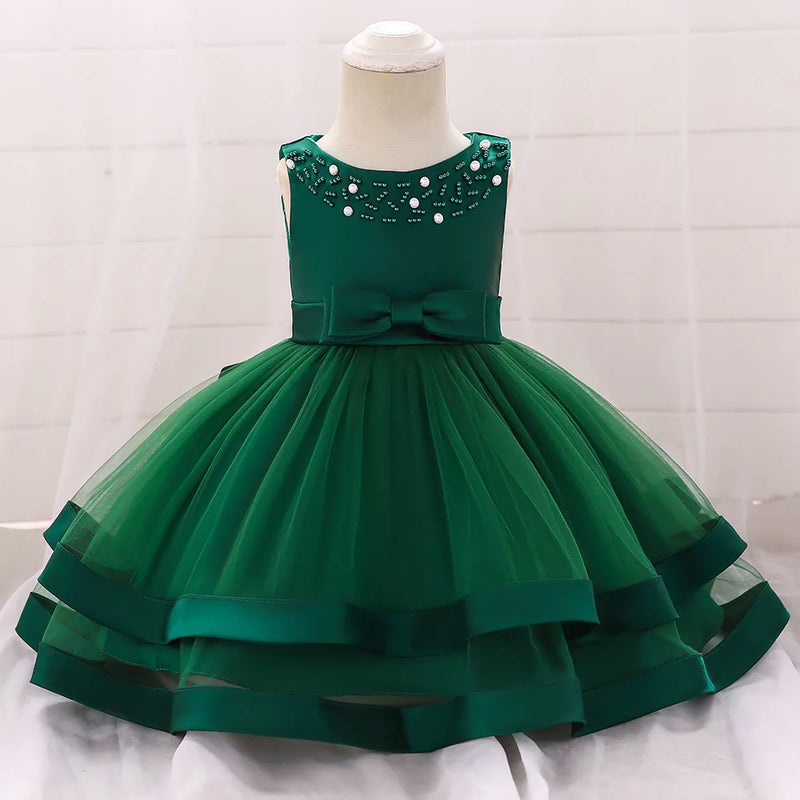 Sacha Marie Elegant Tiered Special Occasion Dress in green featuring a tiered tulle skirt, embellished bodice, and a cute bow, perfect for little girls' formal events.