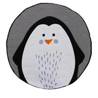 Round penguin-shaped mat with black and white stripes on a white background