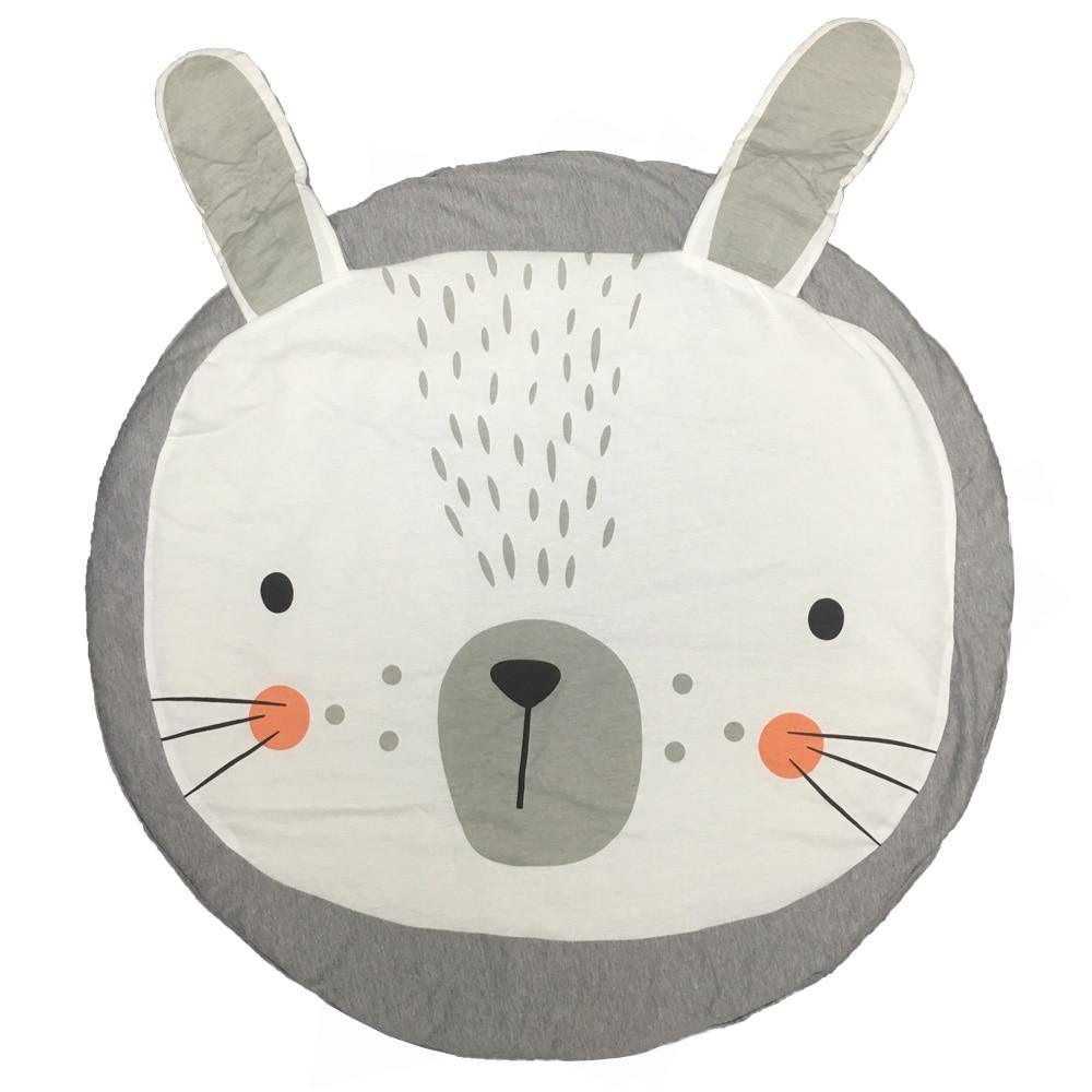 Round cushion with a bear face design on a white background
