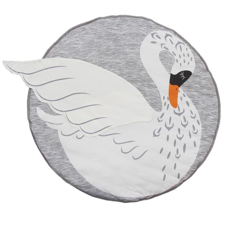Round cushion with a swan design on a gray background