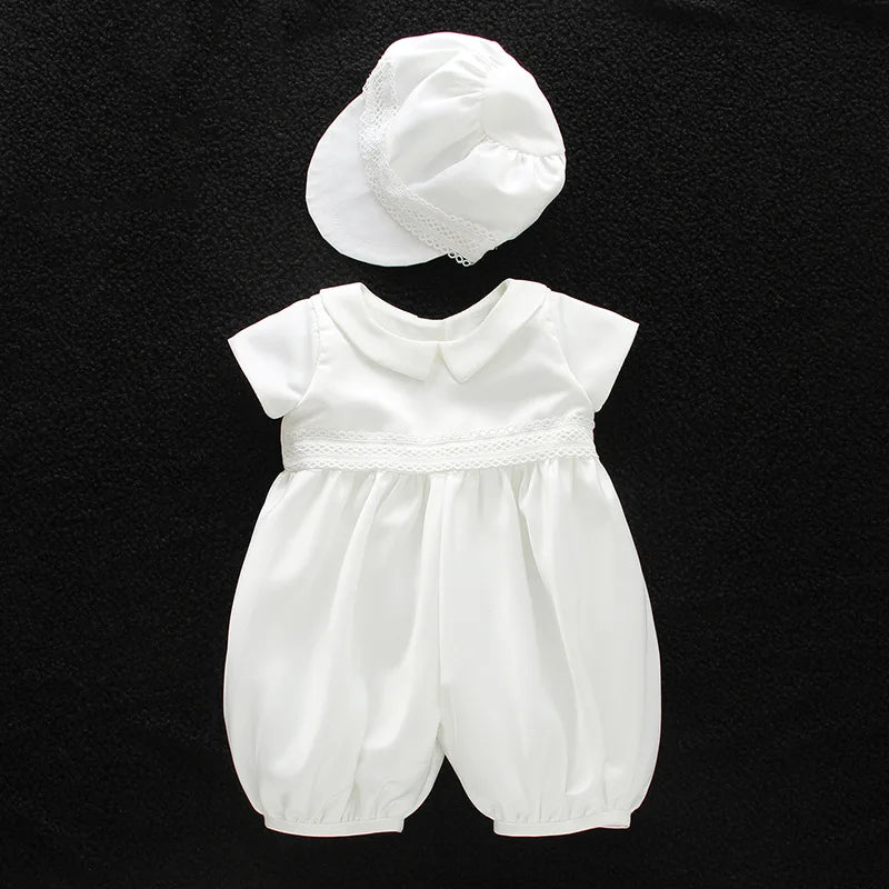 White baby romper with turn-down collar and lace trim, paired with a matching cap for formal special occasions.