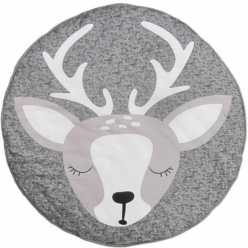 Round gray rug with a deer face design on a white background