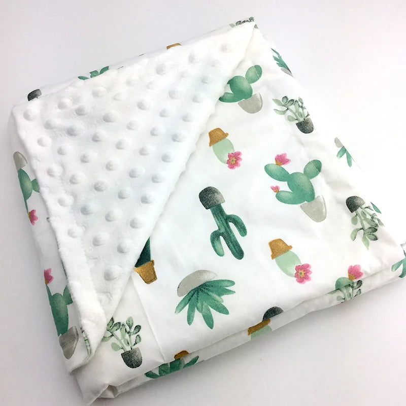Dotted white minky blanket with colorful cactus prints, 100 x 75 cm, for babies and young children.