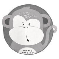 Round mat with a monkey face design on a white background