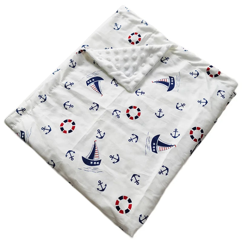 Dotted Minky blanket with nautical prints—anchors, lifebuoys, and sailboats on white.