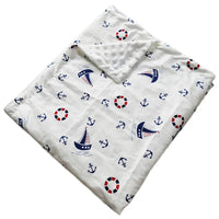 Dotted Minky blanket with nautical prints—anchors, lifebuoys, and sailboats on white.
