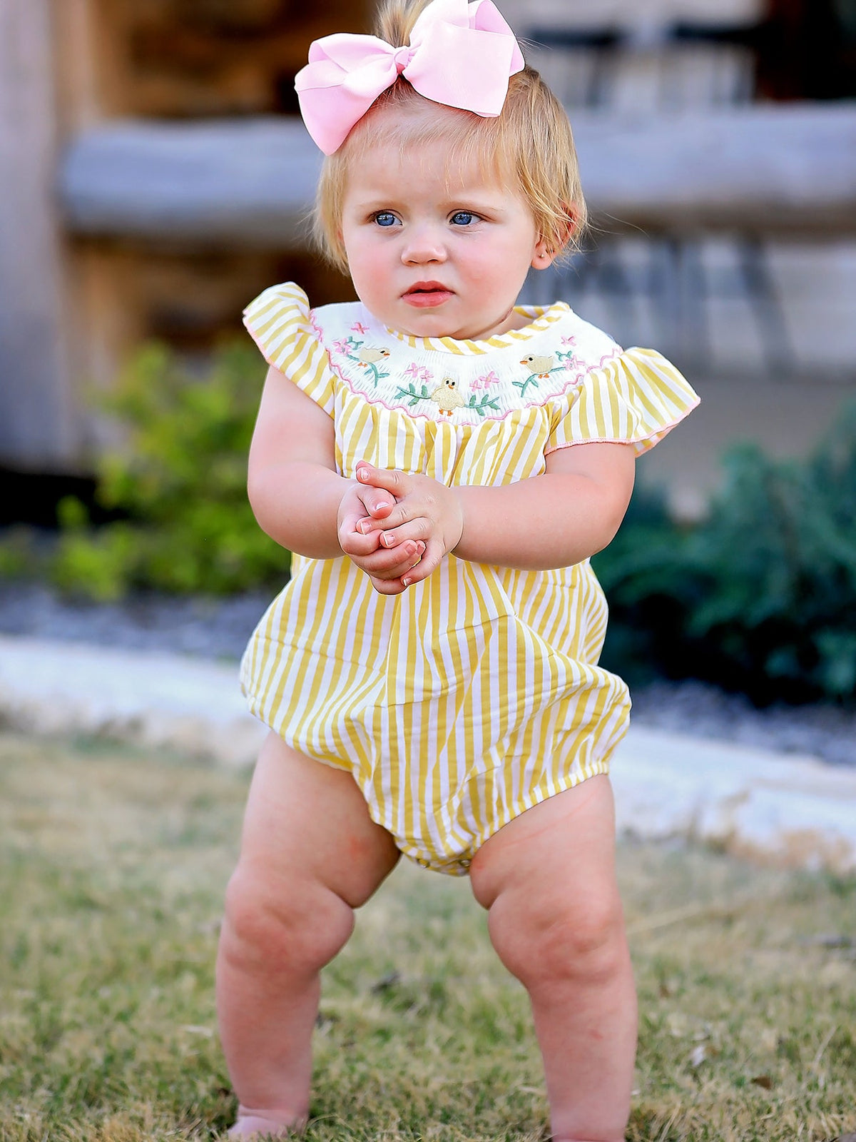 Spring/Summer Chick Floral Embroidery Smocking Girls Romper showcasing vibrant floral details and delicate smocking design.