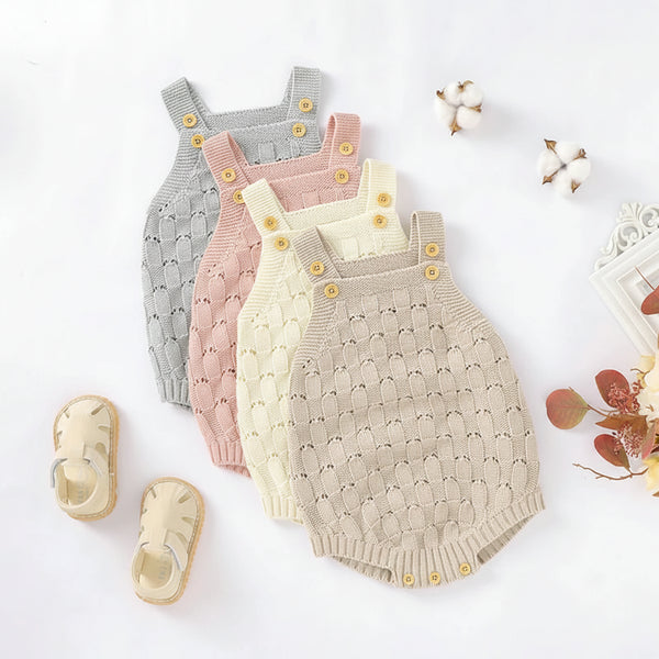Four baby knit sleeveless overalls in light gray, dusty pink, cream, and oatmeal beige, arranged in a fan shape on a white background with decorative cotton bolls, dried leaves, and a pair of baby sandals. The brand name 'mimixiong' is visible in the top left corner.
