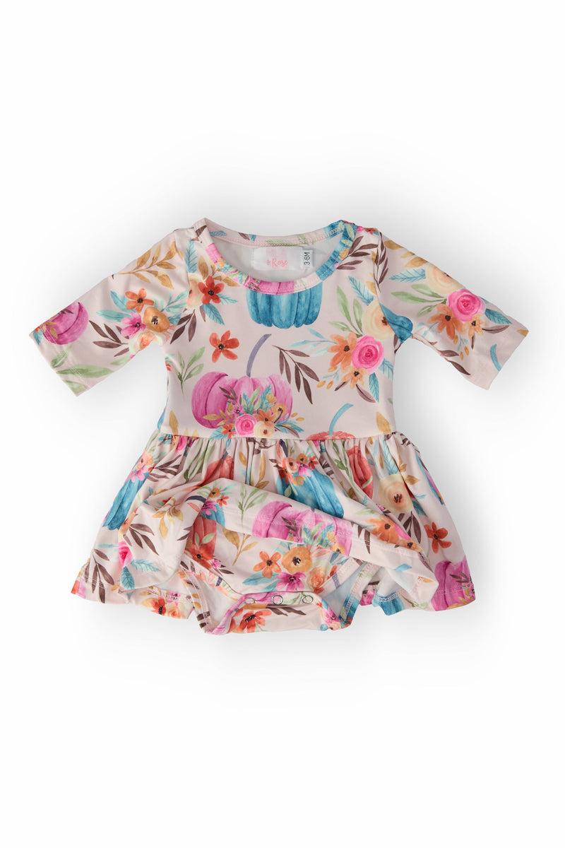 Harvest Blooms 3/4 Sleeve Twirl Bodysuit showcasing a delightful blend of colors and flowers, perfect for your little one's fun adventures.