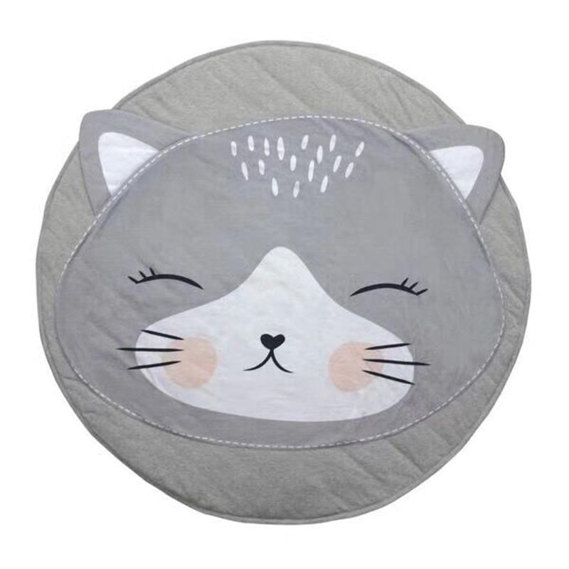 Gray cat-shaped cushion with a smiling face on a white background