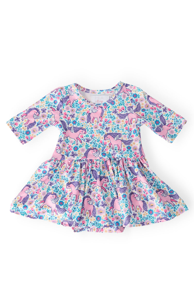 Head in the Clouds 3/4 Sleeve Twirl Bodysuit featuring a colorful unicorn print, perfect for playful twirling. Ideal for little fashionistas, it combines comfort and style.