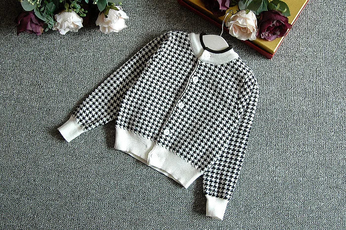 Back view of the Sacha Marie Knitted Girls Houndstooth cardigan in black, part of the girls houndstooth skirt set for stylish comfort.