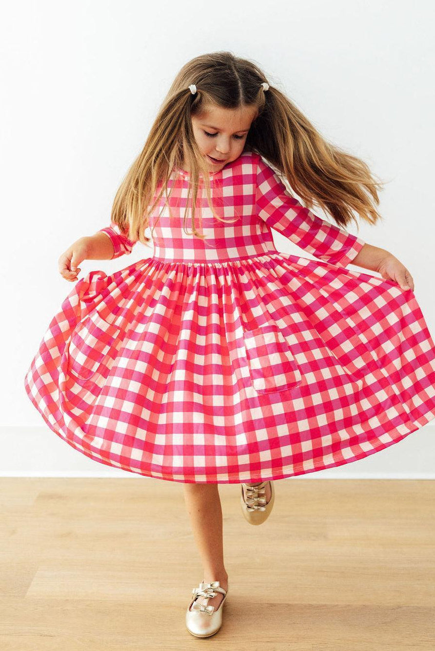 Hot Pink Gingham 3/4 Sleeve Pocket Twirl Dress with Pockets for Girls, a playful twirl dress with pockets, perfect for school and play.