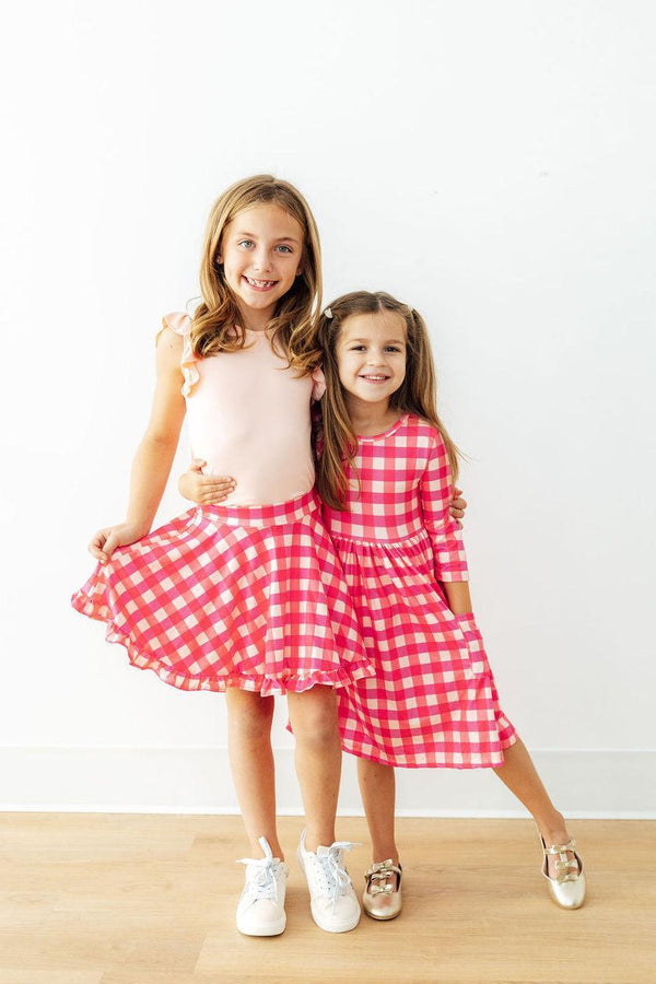 Adorable Hot Pink Gingham 3/4 Sleeve Pocket Twirl Dress with Pockets for Girls, designed for comfort and fun, featuring a twirl skirt and pockets.