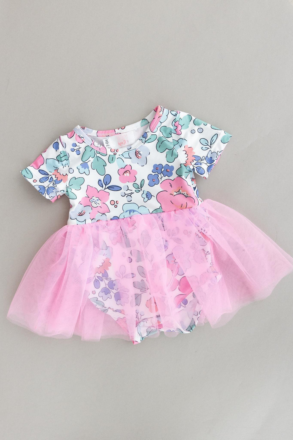 Hydrangea Tutu Bodysuit featuring a floral print top and a pink tulle skirt, perfect for playful baby outfits.