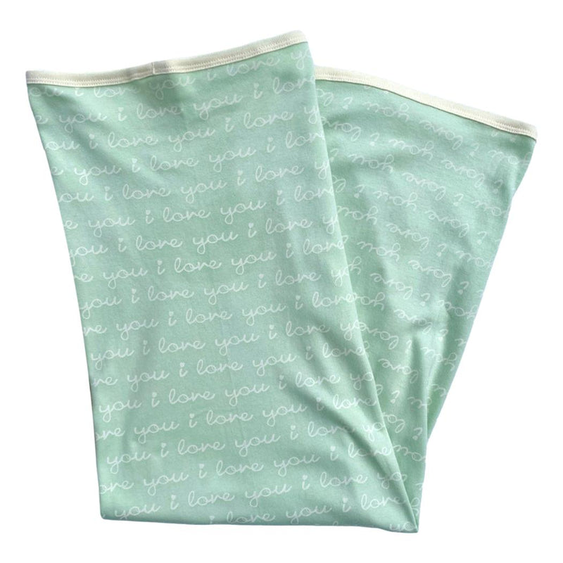 GOTS certified organic cotton baby blanket in desert green with white "i love you" script pattern and cream binding.
