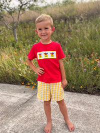 Back to School Crayon Smocked Boys Plaid Shorts Set: boy in red tee with crayon embroidery and yellow gingham shorts.