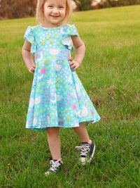 Aqua Spring Chicken Floral Farm Print Dress for Girls displayed on a hanger, showcasing its charming floral farm print.