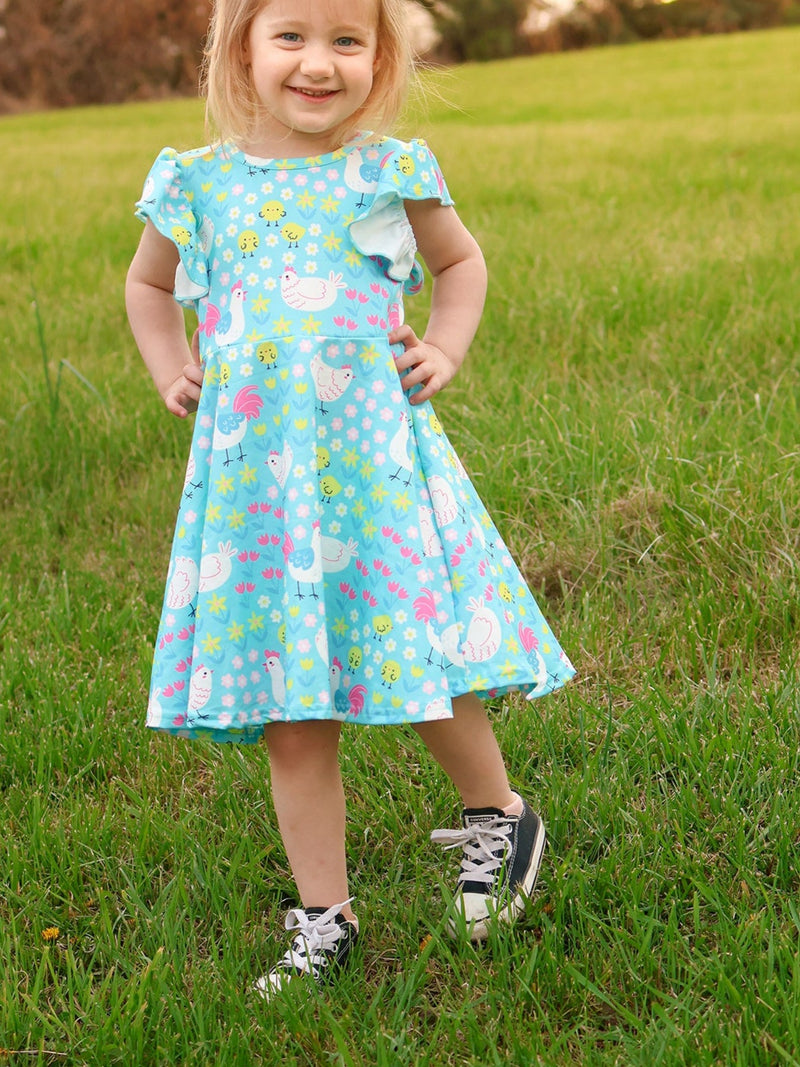 Aqua Spring Chicken Floral Farm Print Dress for Girls displayed on a hanger, showcasing its charming floral farm print.