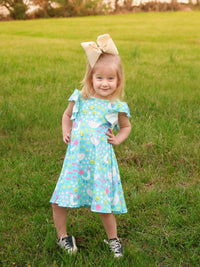 Aqua Spring Chicken Floral Farm Print Dress for Girls styled with summer sandals, perfect for a spring garden party.