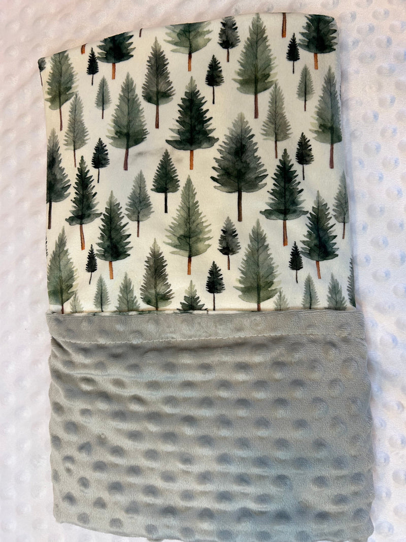 Kids delighting under the Woodland Whispers Minky Blanket, highlighting its ideal size for toddlers and comfort for everyone.