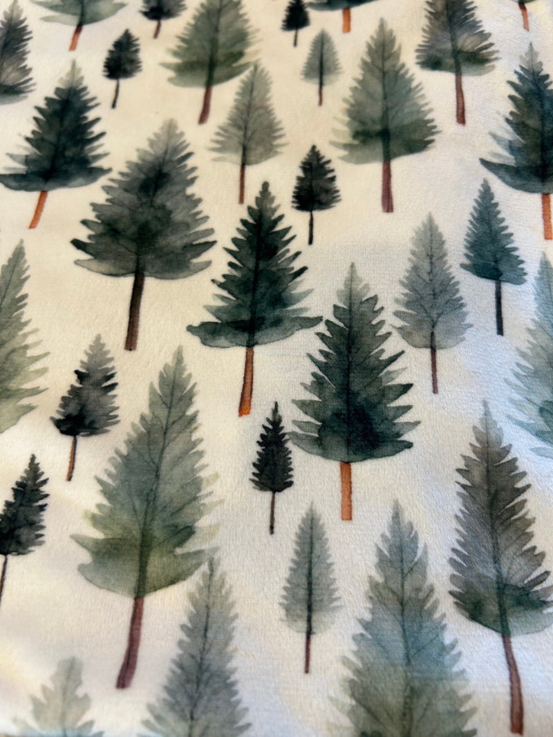 Close-up of the Woodland Whispers Minky Blanket's hypoallergenic fabric, ensuring comfort for sensitive skin and stylish warmth.