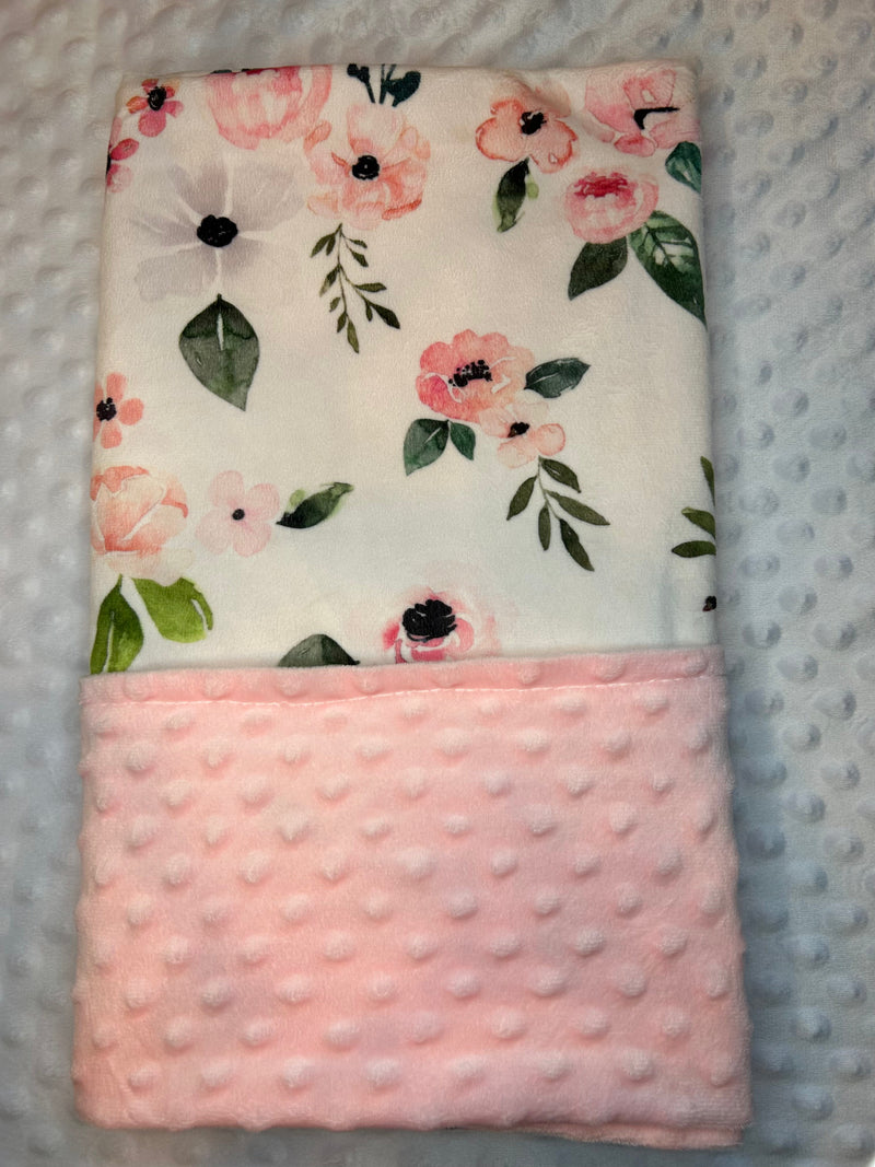 Flowers Forever Minky Blanket - Pink in a nursery setting, illustrating its stylish and functional design that complements any decor.