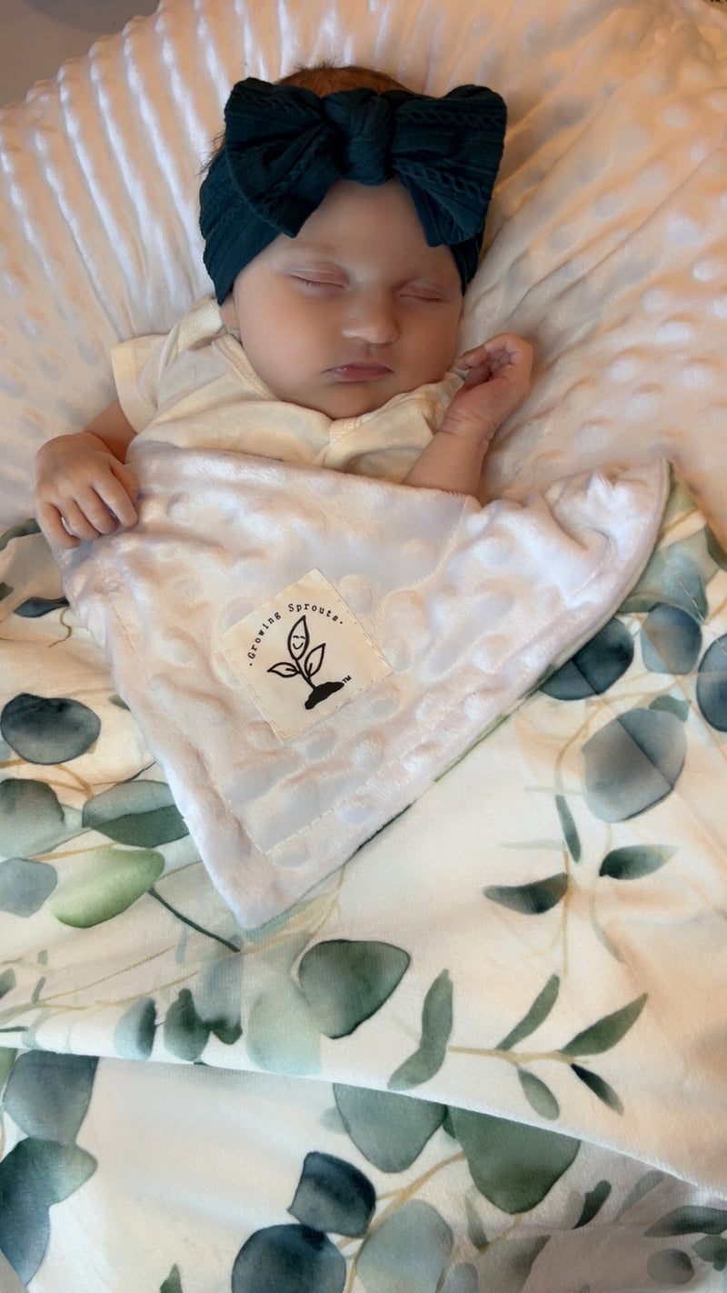 Eucalyptus Embrace Minky Blanket showcasing soft texture and artistic watercolor designs, perfect for cozying up in style.