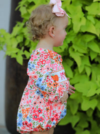 Fall Halloween Pumpkin Bow Smock Romper with floral embroidery; cute baby girl with pink bow headband outdoors.