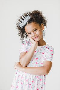 Mermaid Scales Short Sleeve Pocket Twirl Dress for Girls worn by a smiling girl with silver crown and glitter.
