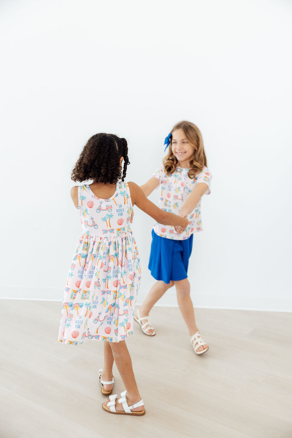 Front view of the Sweet La Dolce Vita Summer Tank Twirl Dress for Girls showcasing its scoop back design.
