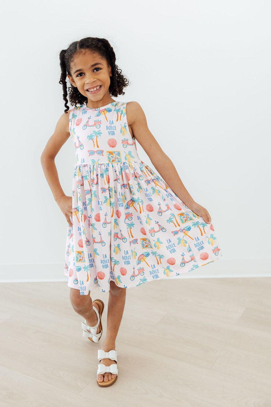 Back view of the Sweet La Dolce Vita Summer Tank Twirl Dress for Girls highlighting the cute neckline and twirl-ready skirt.