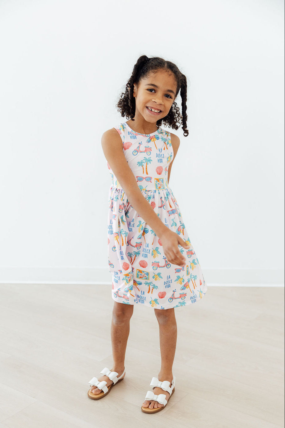 Close-up of the fabric of the Sweet La Dolce Vita Summer Tank Twirl Dress for Girls illustrating its premium texture.