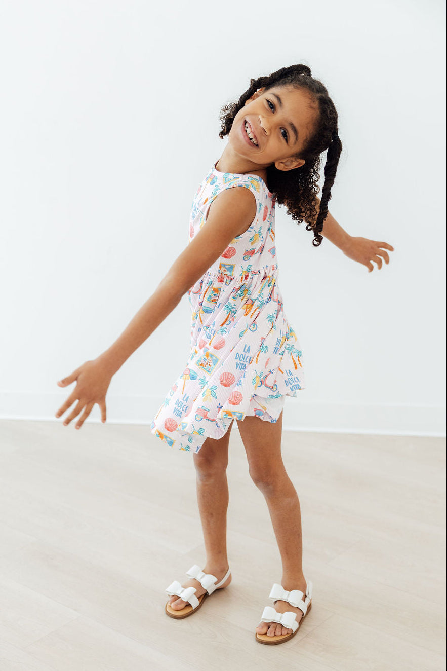 Stylish combination of the Sweet La Dolce Vita Summer Tank Twirl Dress for Girls with twirl shorts, ideal for versatile summer outfits.