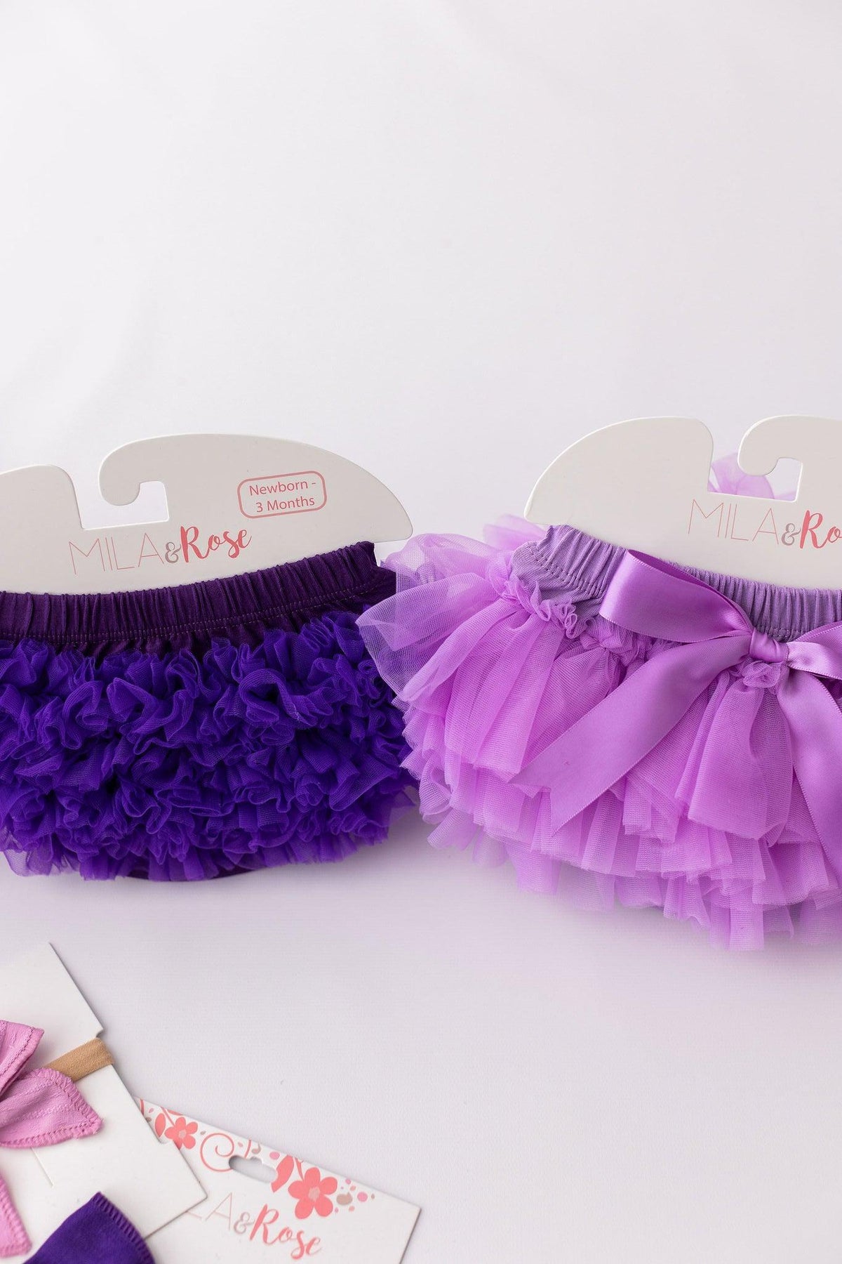 Set of Lavender Ruffle Tutu Bloomers in purple shades by Mila & Rose®, featuring adorable ruffles and bows, ideal for newborns.