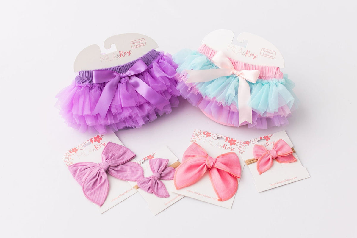 Lavender Ruffle Tutu Bloomers from Mila & Rose® displayed with matching hair accessories, showcasing a whimsical and stylish baby outfit.
