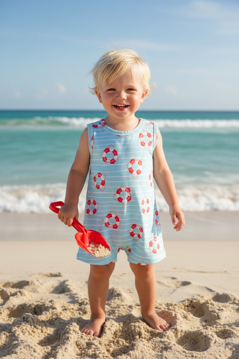 Children's sleeveless romper with life buoy pattern on a light blue background