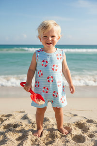 Children's sleeveless romper with life buoy pattern on a light blue background