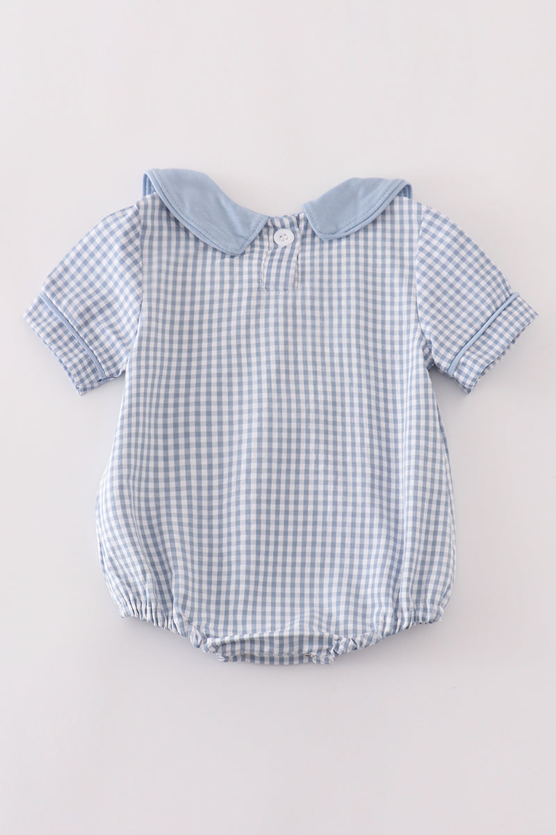 Blue woven check boy bubble romper with solid blue Peter Pan collar, short sleeves, and gathered leg openings for everyday wear.
