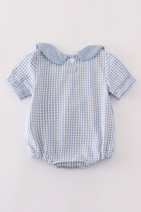 Blue woven check boy bubble romper with solid blue Peter Pan collar, short sleeves, and gathered leg openings for everyday wear.