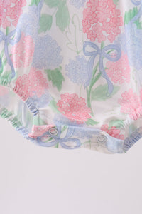 Floral pattern with pink and blue flowers and ribbons on a white background