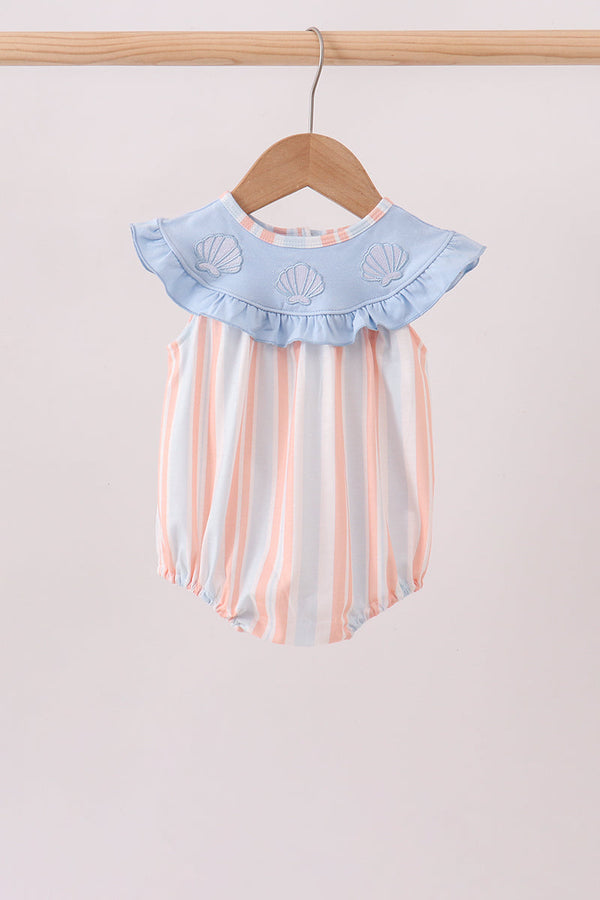 Pink and blue stripe baby bubble romper with ruffled collar and embroidered seashells hanging on wooden hanger