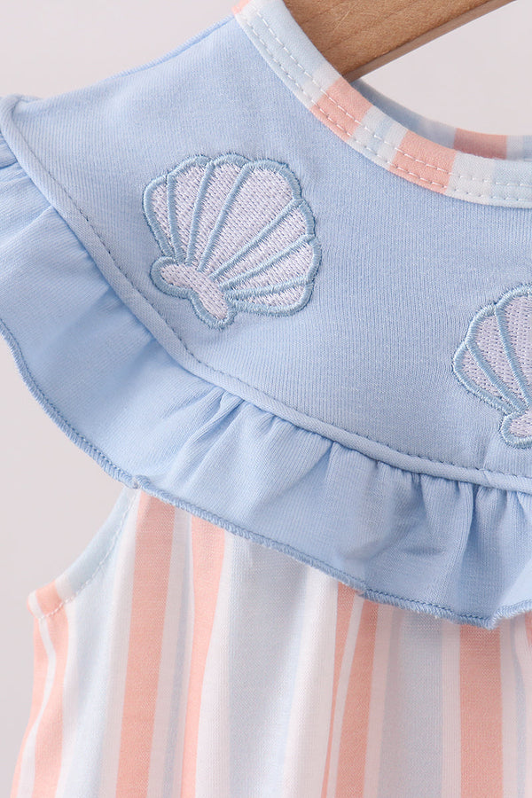 Light blue bubble top with delicate seashell embroidery, ruffled detail, and coastal pink stripe design.