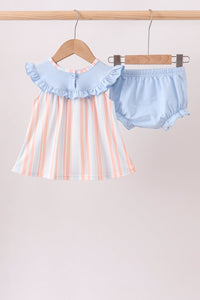 Pink and blue striped toddler tank with ruffled collar paired with light blue seashell embroidered bloomers on wooden hangers.